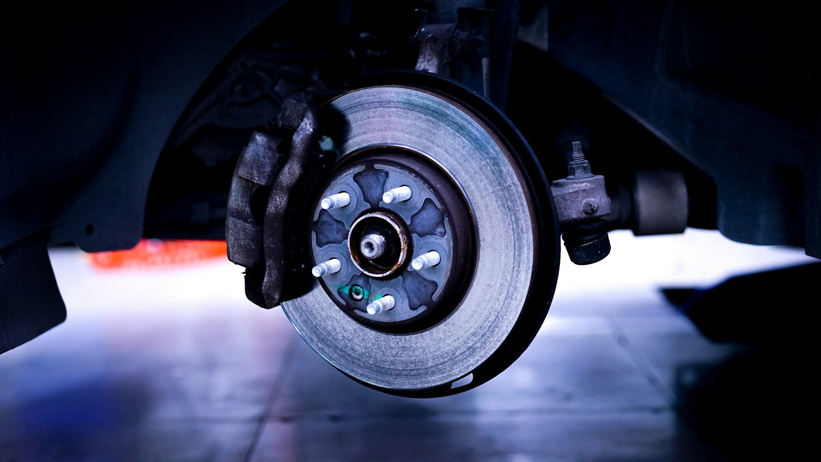 Close-up of a brake rotor and caliper on a car wheel
