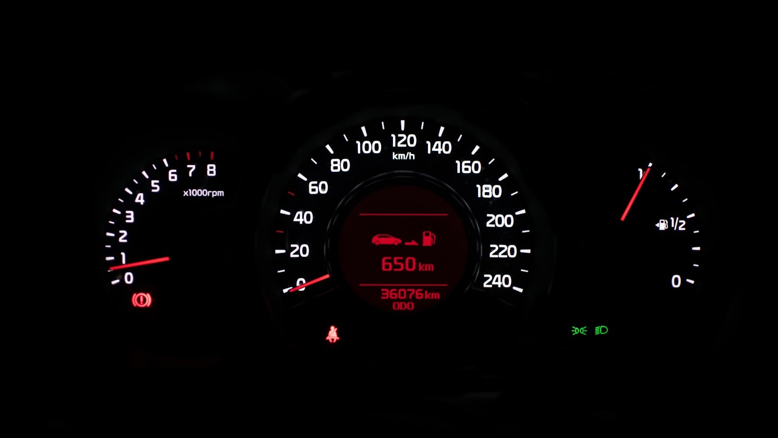 A car instrument cluster lit up with warning lights