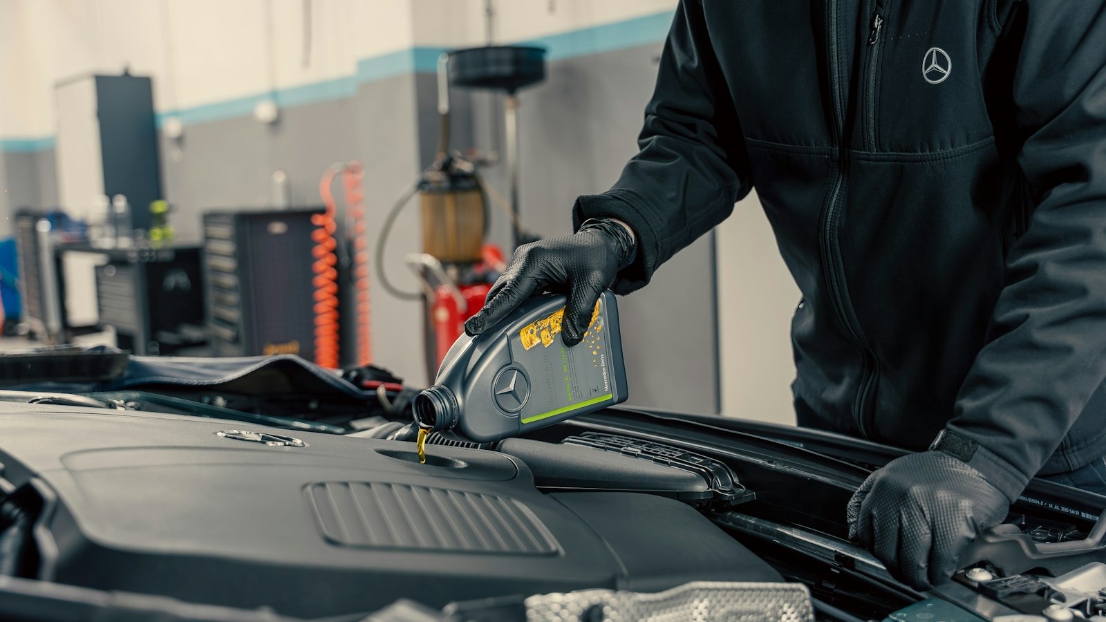 Fresh engine oil being poured into an engine